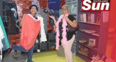 Zina Nazer and Yess co-founder Linda James pick out pieces they like at the new thrift shop.