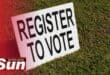 Register to vote board on grass