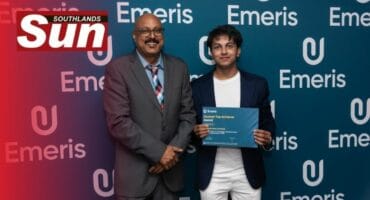 Emeris Durban north’s Jorryn Panjasuran accepts his Full Stack Impact Award from campus head at Emeris Durban North Rajesh Chandarman.