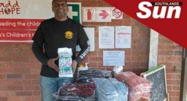 Wasp’s Brian Naidoo with some of the donated clothing handed out to St Monica’s Children’s Home.