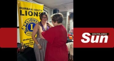 Previous Durban South Lions president Vanessa Wilesmith hands over the baton to new Lions president Christa Human.