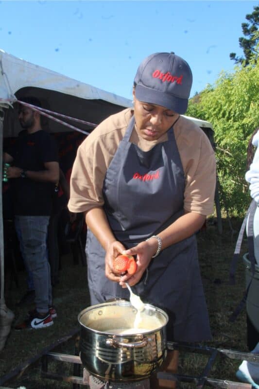Thabisile Shandu from team Taste Masters spices her pap. 