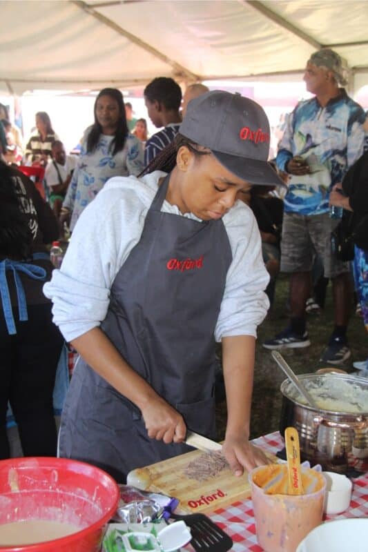 Kwanda Matheba slices up the chocolate thinly for her team's tart. 