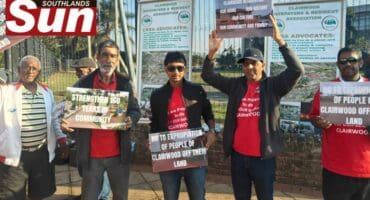 Members of the Clairwood Ratepayers and Residents Association are protesting outside the Durban Magistrate's Court.