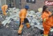 Durban Solid Waste workers remove waste dumped along Maharaj Road in Clairwood.