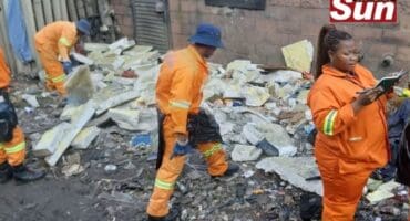 Durban Solid Waste workers remove waste dumped along Maharaj Road in Clairwood.