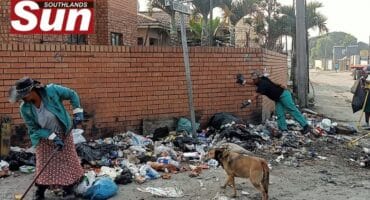Teams from eThekwini Municipality and residents clean a dumpsite in Clairwood.