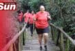 Lenore Tissong crosses the bridge tucked into the nature reserve.