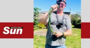 Warren Dick with the captured green mamba.