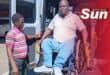 Resident Bheki Mgwaba is being transferred into the new vehicle.