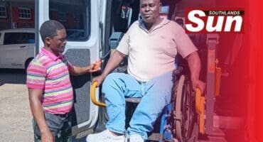 Resident Bheki Mgwaba is being transferred into the new vehicle.