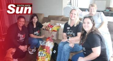 SUN staff members with donation of goods