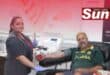 South African National Blood Service’s Jamie Louis helps regular donor Christiaan Bester.