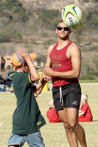 Aswin Scott enjoys a game of touch rugby with the little ones.
