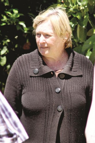 Ms Gwen Mason speaks to the police after the murder of her husband.