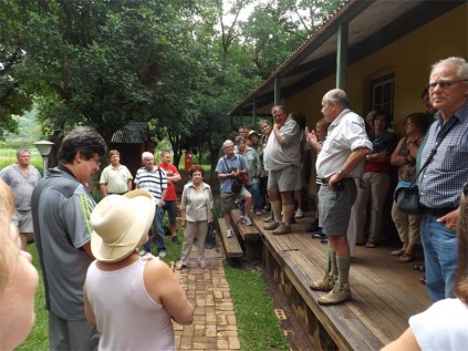 Well-known Mpumalanga tour operator, Louis John Haveman sharing his historical knowledge from the veranda at Krugerhof at Waterval Onder.
