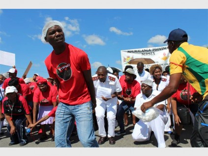 Protesters held up placcards expressing their fury at the alleged rapists and the police's service.