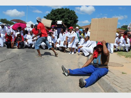 Protesters held up posters showing their grief. Photos: Marinette Potgieter