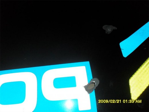 The marked police vehicle's engine ceased after it had been shot.