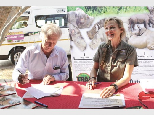 TRAC N4 CEO Graham Esterhuysen and Petronel Niewoudt of Care for Wild Africa during a press conference where the cheque was signed.