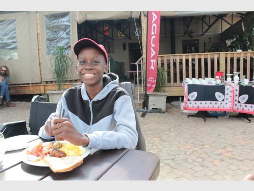 Bongani enjoys his breakfast at Gumtreez, Casterbridge.
