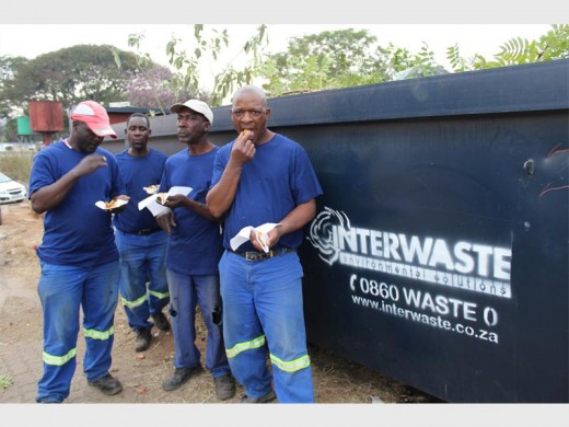Community members and businesses joined in to help clean the area around the train.