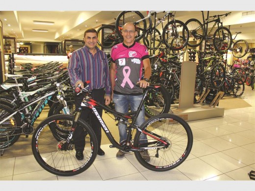 Mr Naeem Omar of Valencia donated a bicycle to Mr Rick Budai.