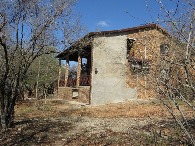 The house where the woman was allegedly pushed over a railing.