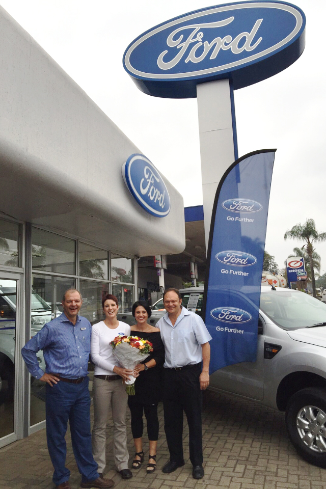 Christo and Leana Pieterse with Marita and Gerrit Kroon in front of Numbi Auto in White River.