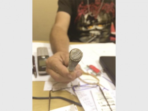 Mr Jimmy Brass shows what he calls "the faulty bolt".