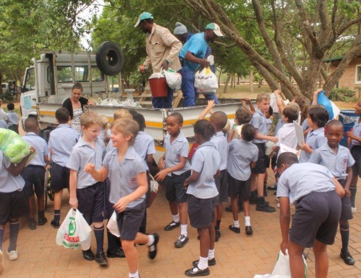 Children help with packing the groceries.