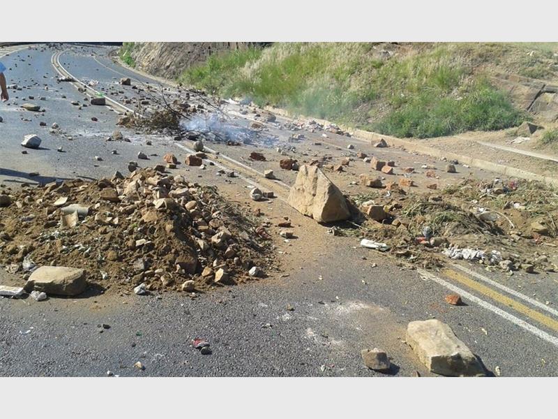 Rocks on the road, as uploaded to Facebook by William Mc.