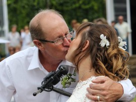 Roy kissed his bride.