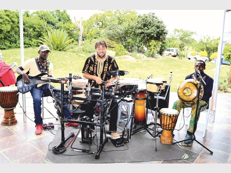 Minanzi Mbira Band's Tendayi Kusaya, Justin Behrendt and Danmore Kusaya. Photo: Elma Slabbert / Elma Photography