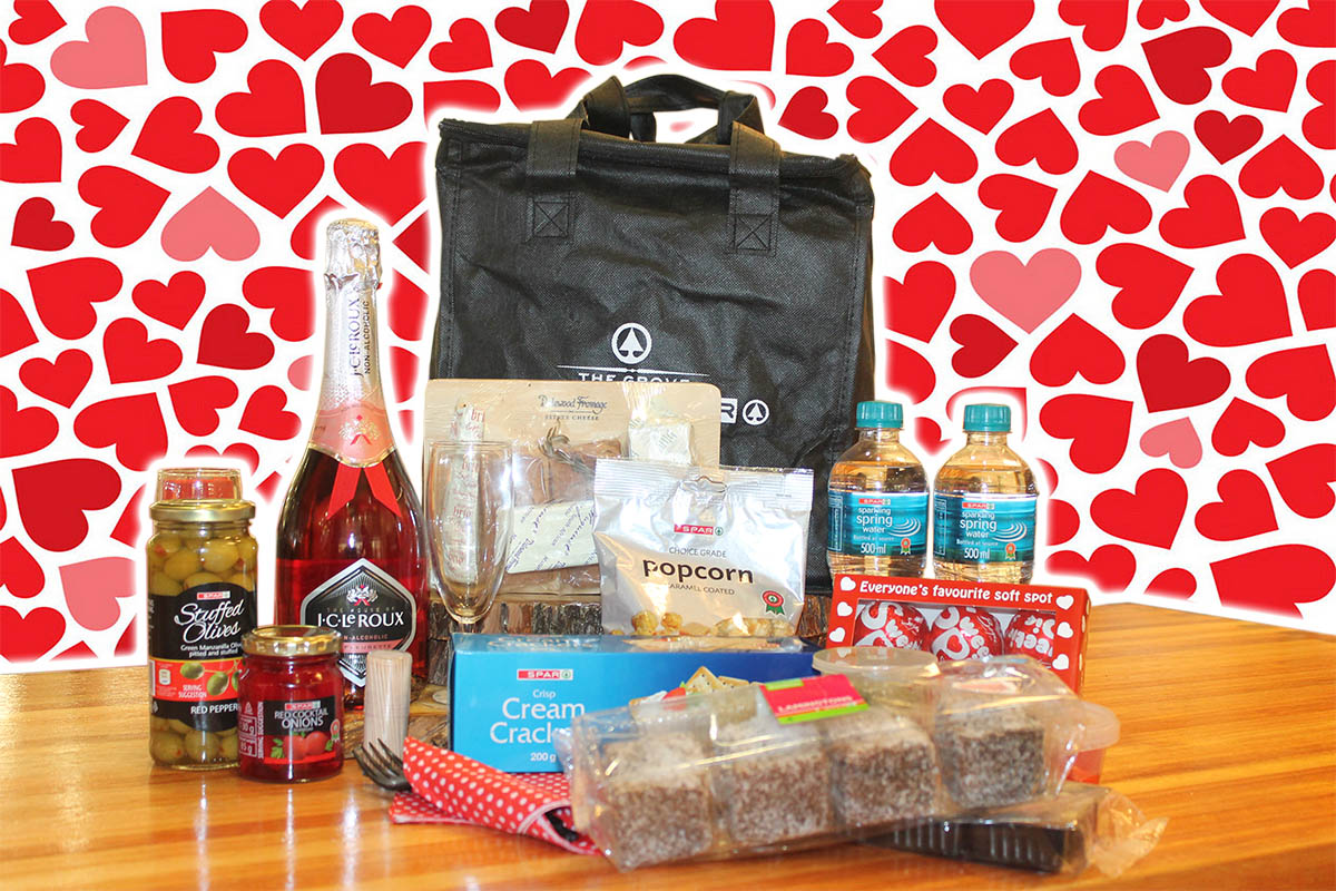 What's in the hamper? Apart from a good load of love, the hamper also contains pesto, hummus, peppadews stuffed with cream cheese, a cheese board complete with cheese, crackers and preserves, cocktail olives, cocktail onions, caramel popcorn, brownies, a box of sweetie pies, non-alcoholic champagne with glasses, napkins and a SPAR cooler bag. You can just add a blanket and some scenery for the most amazing Valentine's Day date ever.