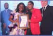 Fezekile Mosiane hands Letlhogonolo Zondi her 10 years service certificate.