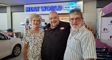 Lizette and Coen Cronje with Tommy Dockson, better known as Vaatjie, at the new Meat World Matumi store. > Photo: Blake Linder