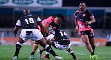 Airlink Pumas' Darnell Osuagwu is tackled by former teammate and Sharks XV winger, Phiko Sobahle. > Photo: Kaptured Concepts