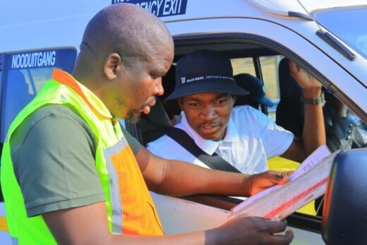 FTLM's Eddie Maila checking taxi permits.