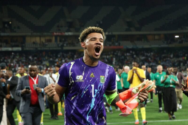 Bafana Bafana captain Ronwen Williams celebrates their World Cup qualification with the supporters in the stands. > Photo: Blake Linder