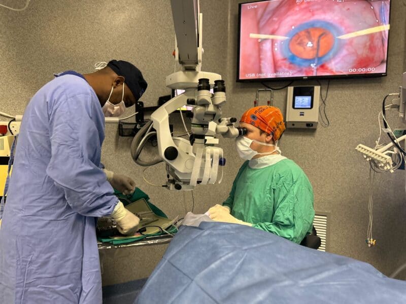 Dr Morgan Hayes with one of his patients. > Photo: Supplied/Nelspruit Eye Institute