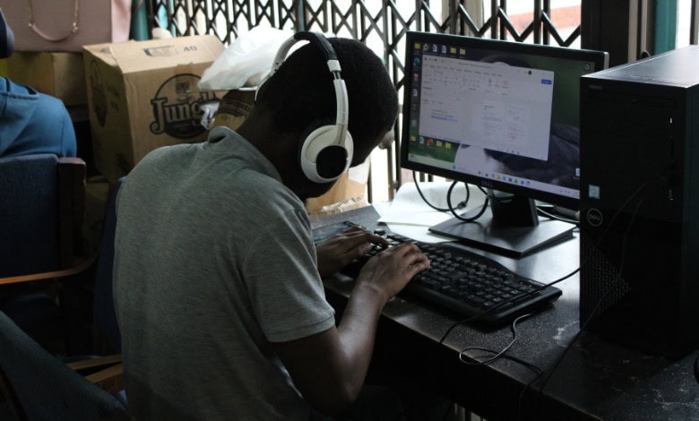 Sibusiso Sambo types on the keyboard.