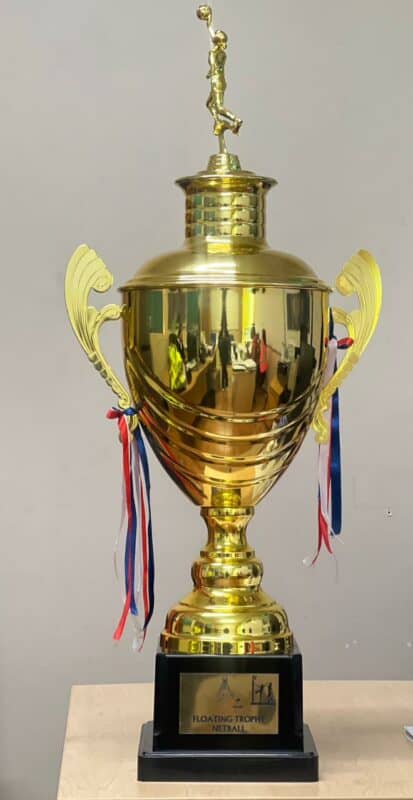 The netball trophy won by the DCM team.