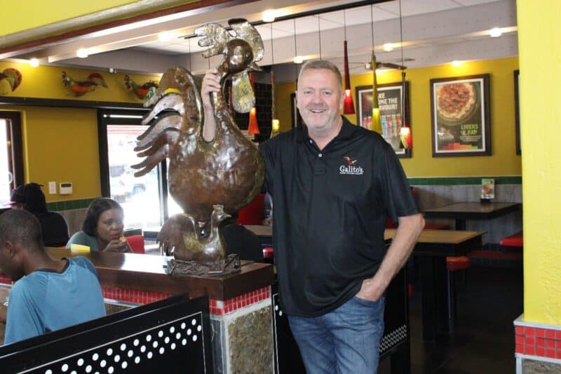 Louis Germishuys with the restaurant's original rooster.
