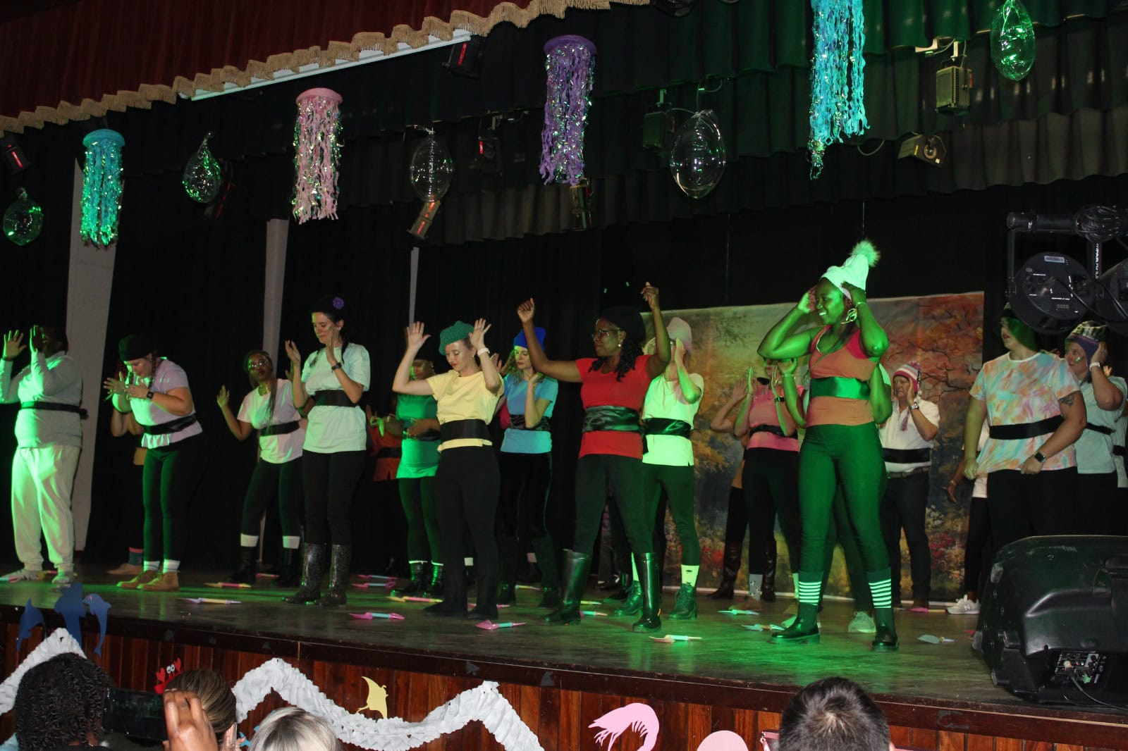 Staff members entertain the audience.