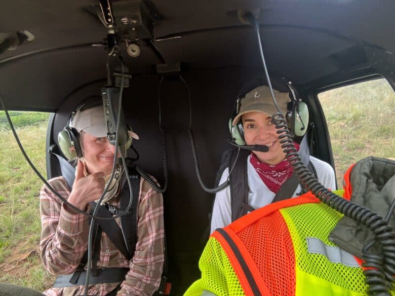 Klaudia Dorota and Jolanta Andzelika sit in the helicopter. 