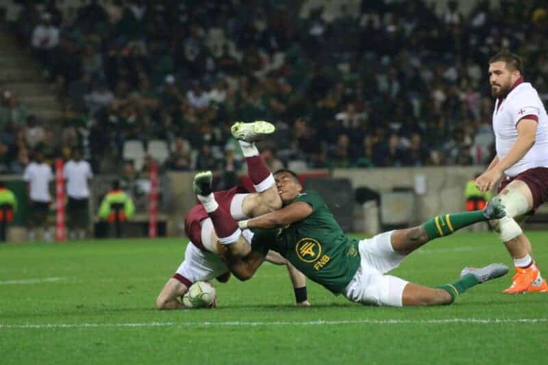 Grant Williams brings down his counterpart, Georgian scrum-half Vasil Lobzhanidze.