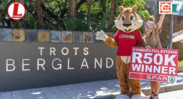 SPAR Lowveld's mascot, Squillo, with Jana Venter of Laerskool Bergland. > Photo: Supplied/SPAR