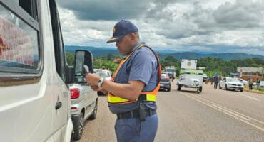 A police officer works at a roadblock.