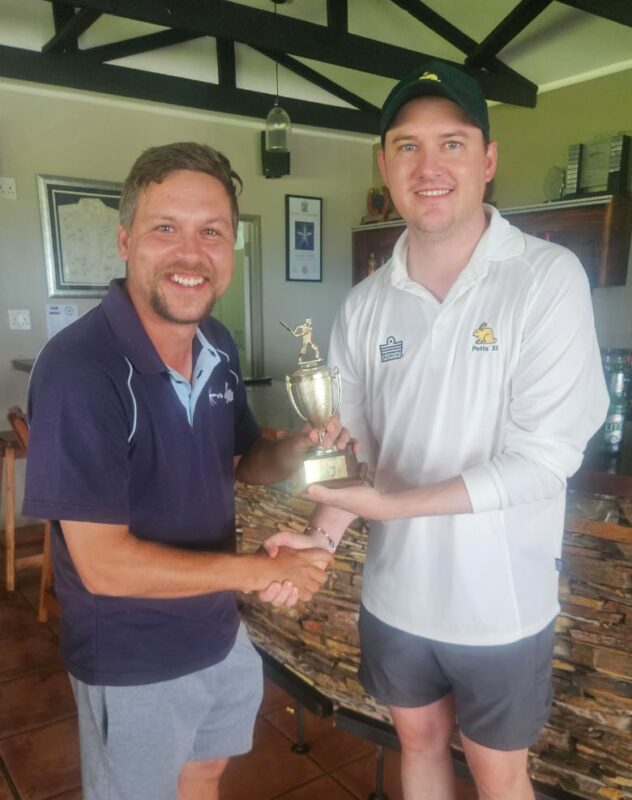 LVCC captain Gavin Kirby receives the trophy from Potts captain Sean Cresswell.